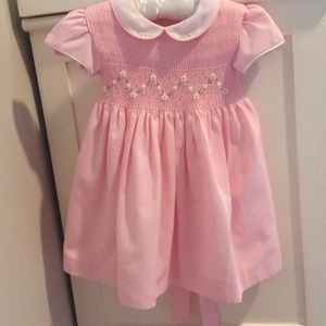 Pink smocked dress with white collar